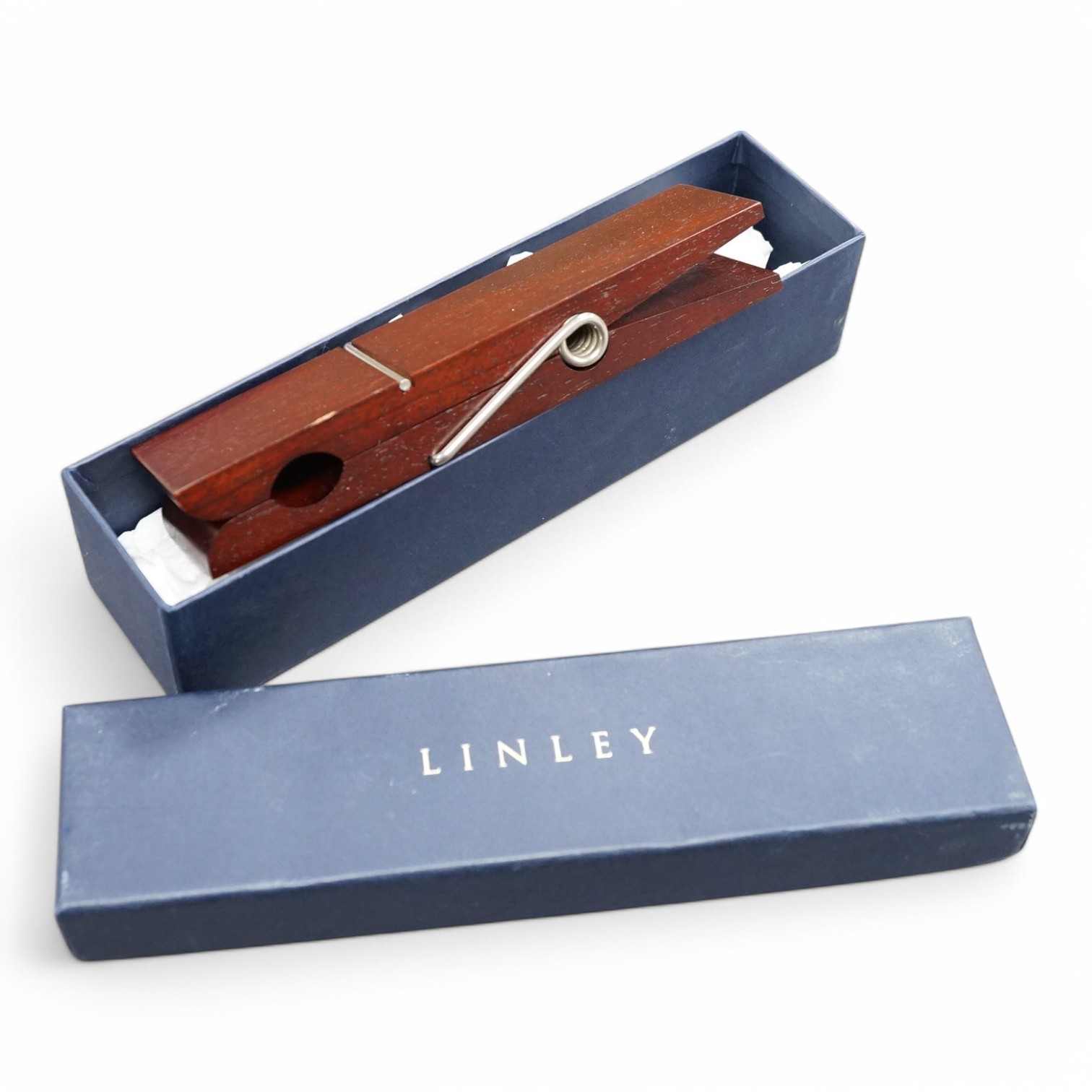 A cased David Linley letter clip in the form of a clothes peg, 15cm in length. Condition - fair, minor scuffs